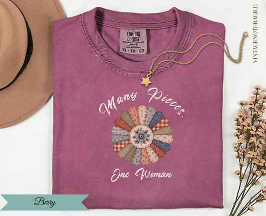 Berry comfort colors t-shirt with "Many Pieces. One Woman." floral quilt design.