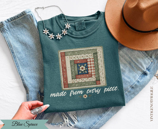 Teal long-sleeve shirt with patchwork square and "made from every piece" text.