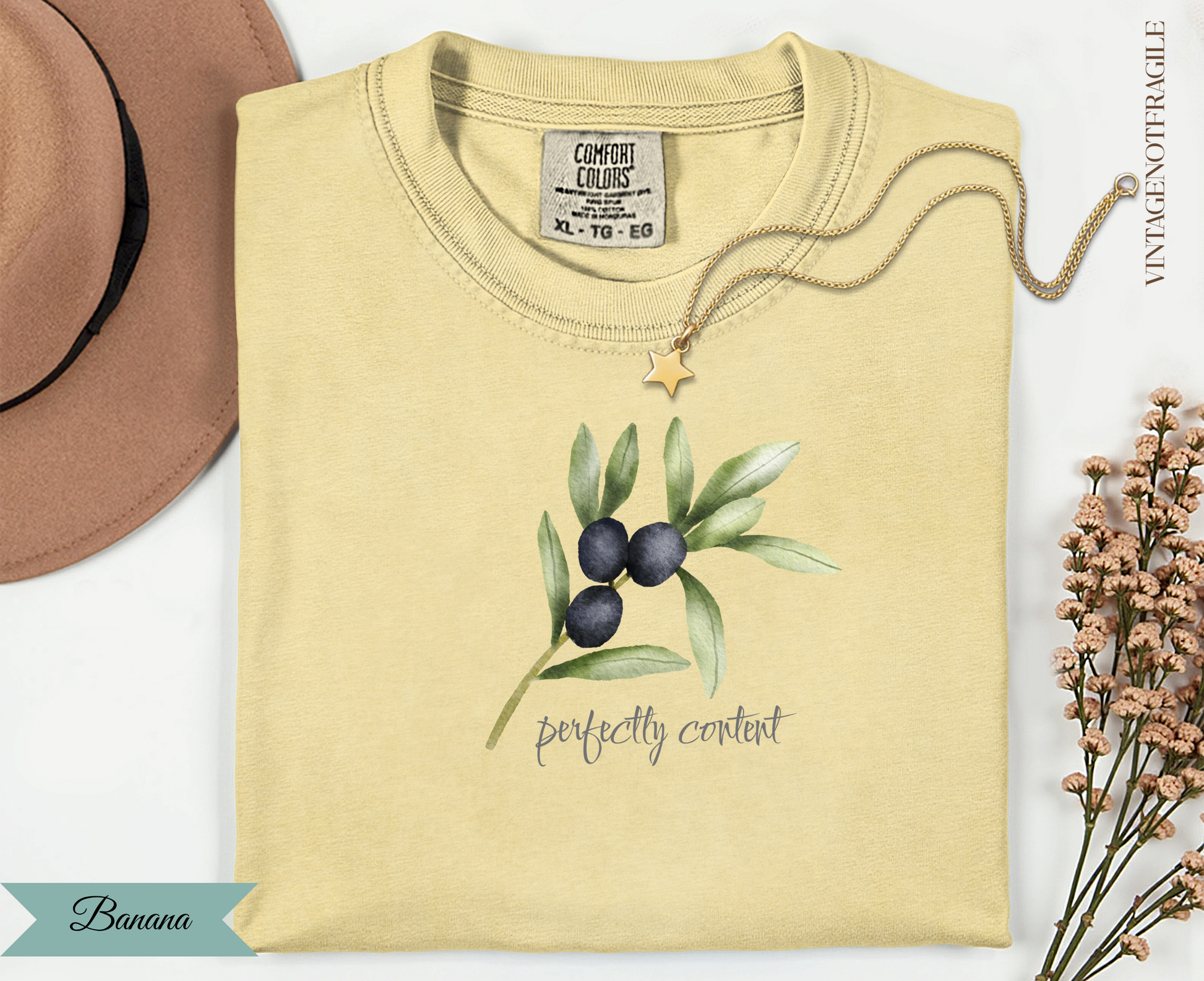 Yellow t-shirt with olive branch graphic and "Perfectly Content" text.