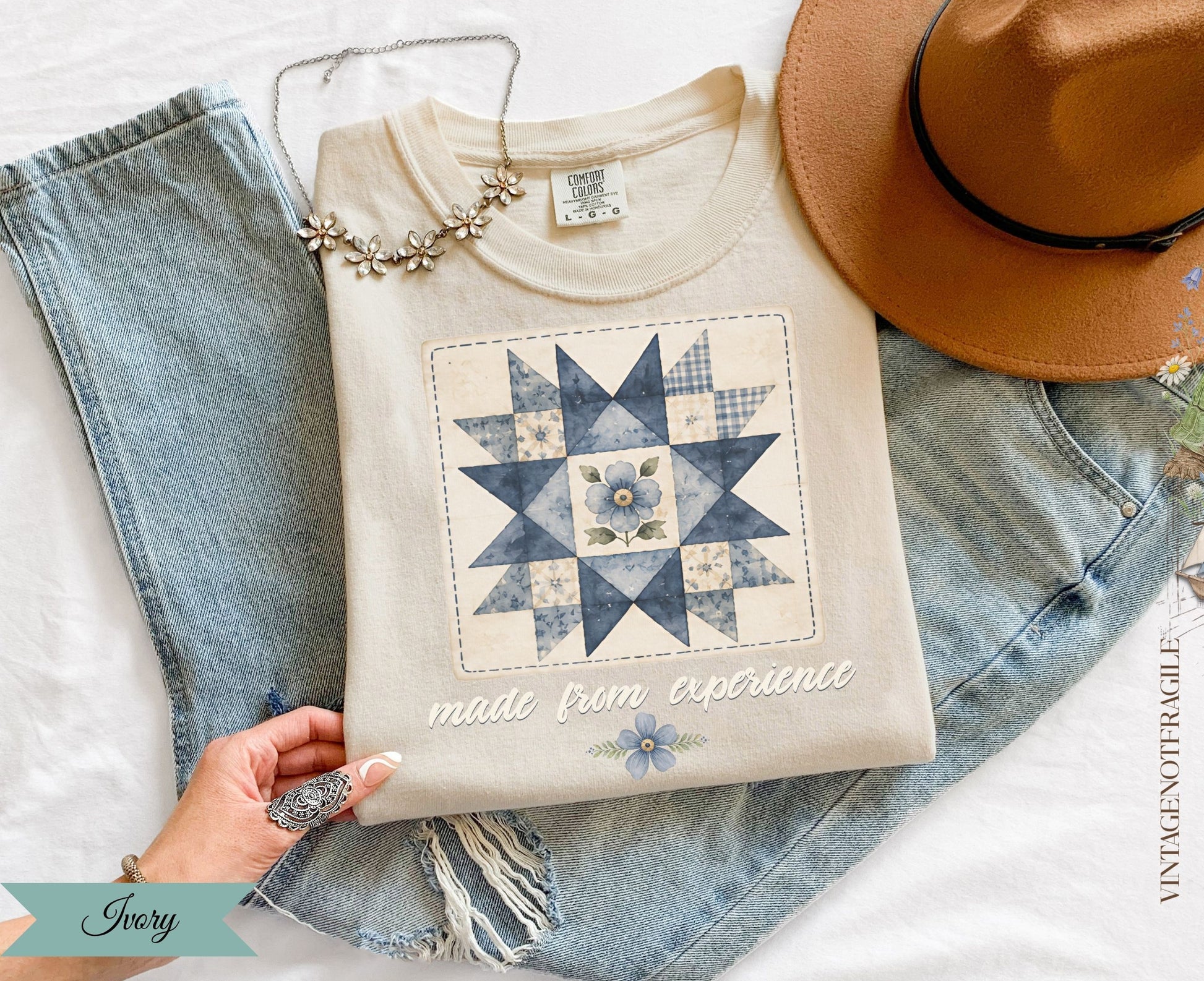 Crewneck sweatshirt with a blue floral quilt design and text "made from experience".