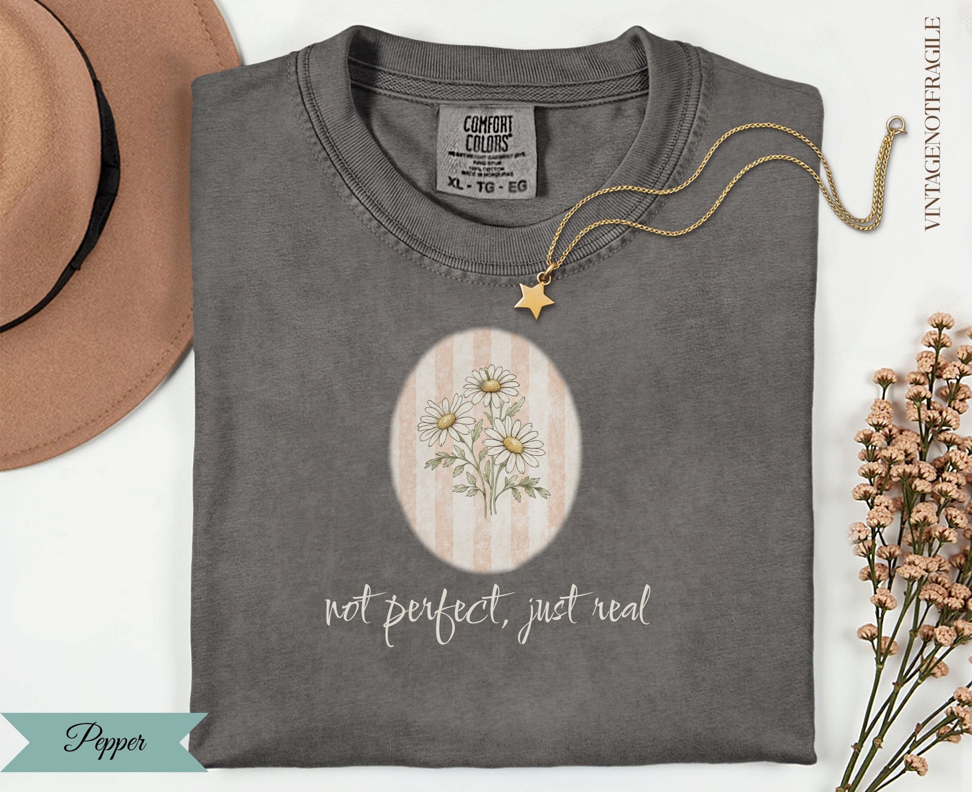 Comfort Colors t-shirt with floral daisy design and "not perfect, just real" text.