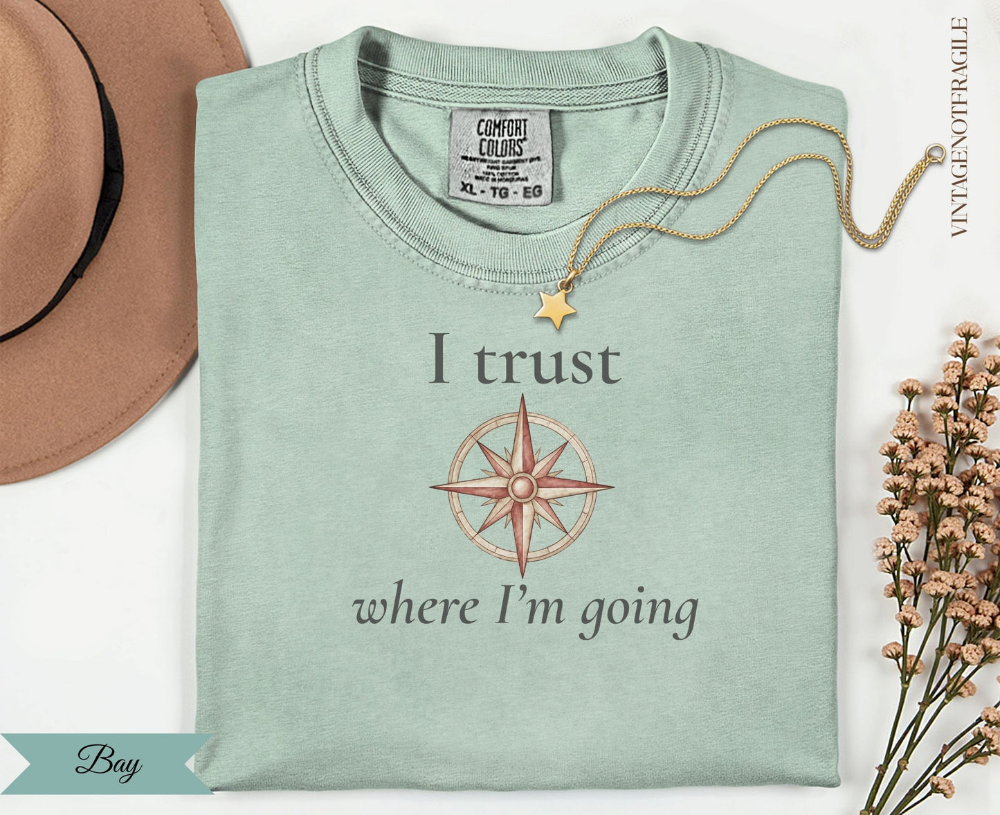 T-shirt with compass graphic and text "I trust where I'm going".