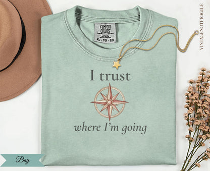T-shirt with compass graphic and text "I trust where I'm going".
