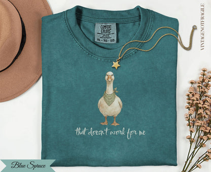 Teal t-shirt with goose wearing bandana and text "that doesn't work for me".