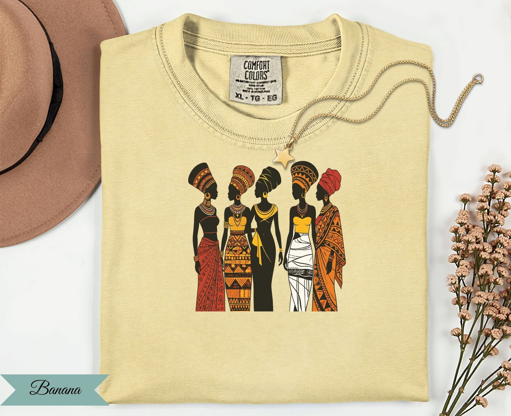 Five women in African-inspired clothing stand together.