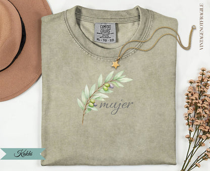 Khaki Comfort Colors t-shirt with olive branch graphic and "mujer" text.