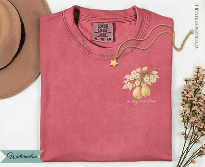 Pink t-shirt with pears and flowers, "in my own time" text.