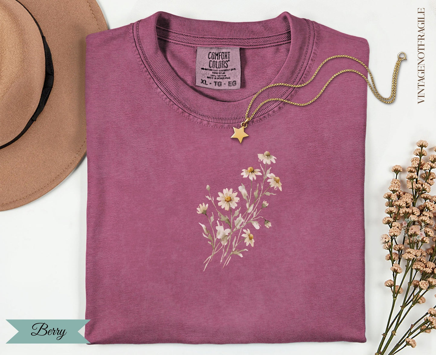 Berry Comfort Colors t-shirt with a floral graphic and gold necklace.