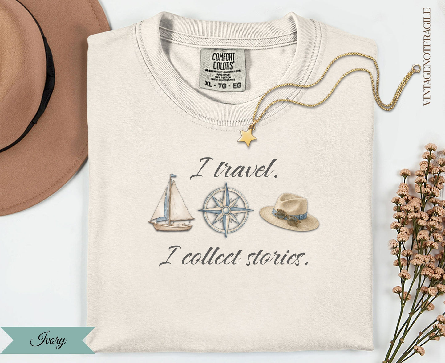 T-shirt with "I travel. I collect stories." and nautical graphics.
