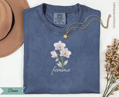 Comfort Colors women's denim t-shirt with white floral graphic and "femme" text.