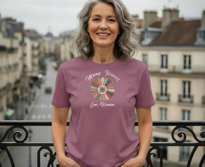 Woman wearing mauve t-shirt with floral quilt circle graphic and text.