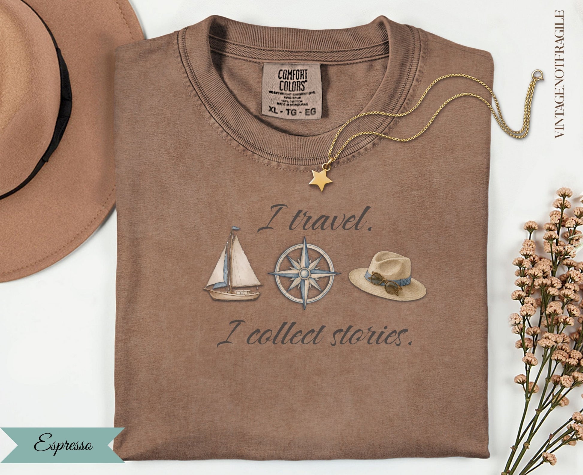 Brown t-shirt with "I travel. I collect stories." and nautical illustrations.