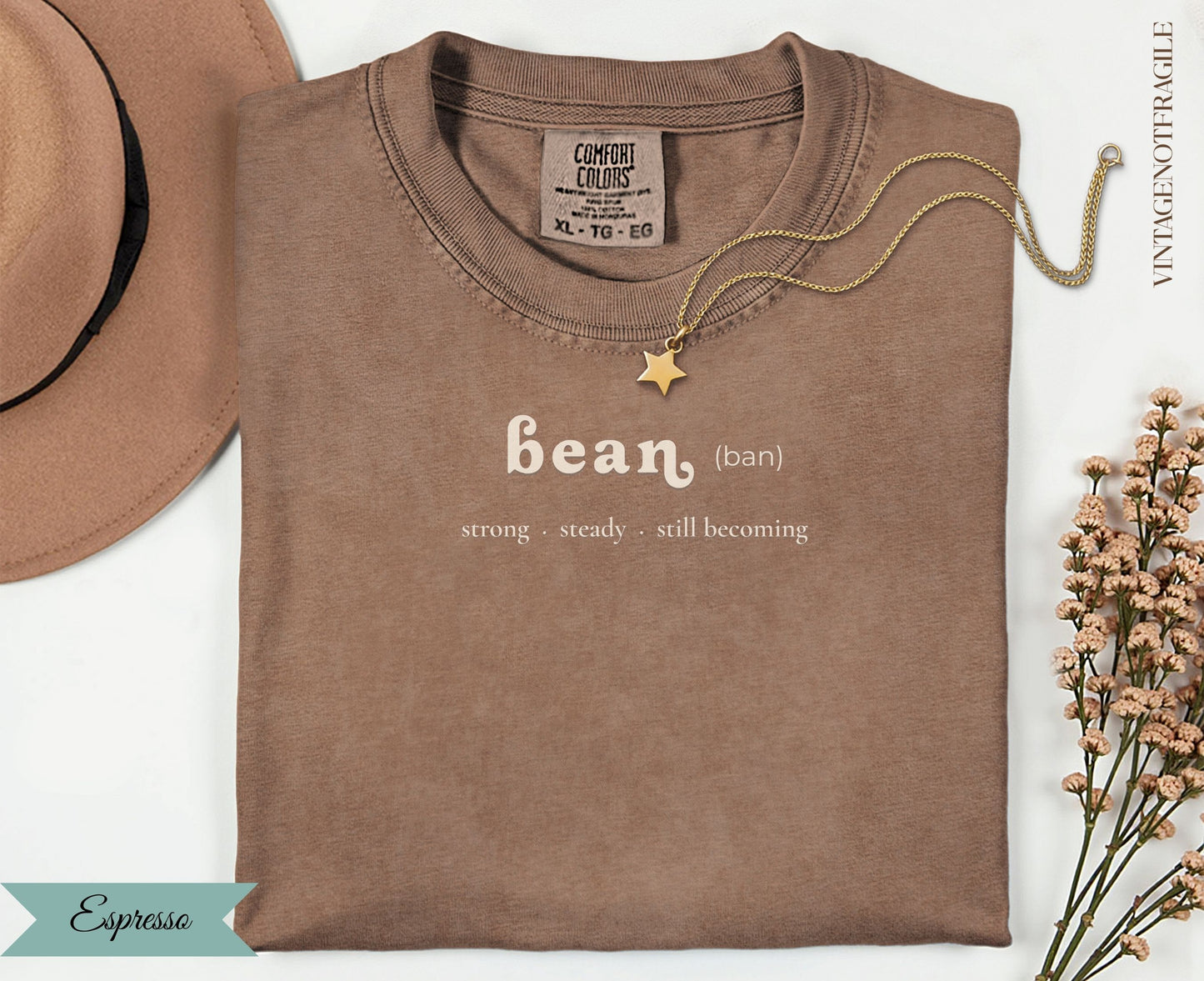 Comfort Colors espresso t-shirt with "bean (ban) strong steady. still becoming" text.