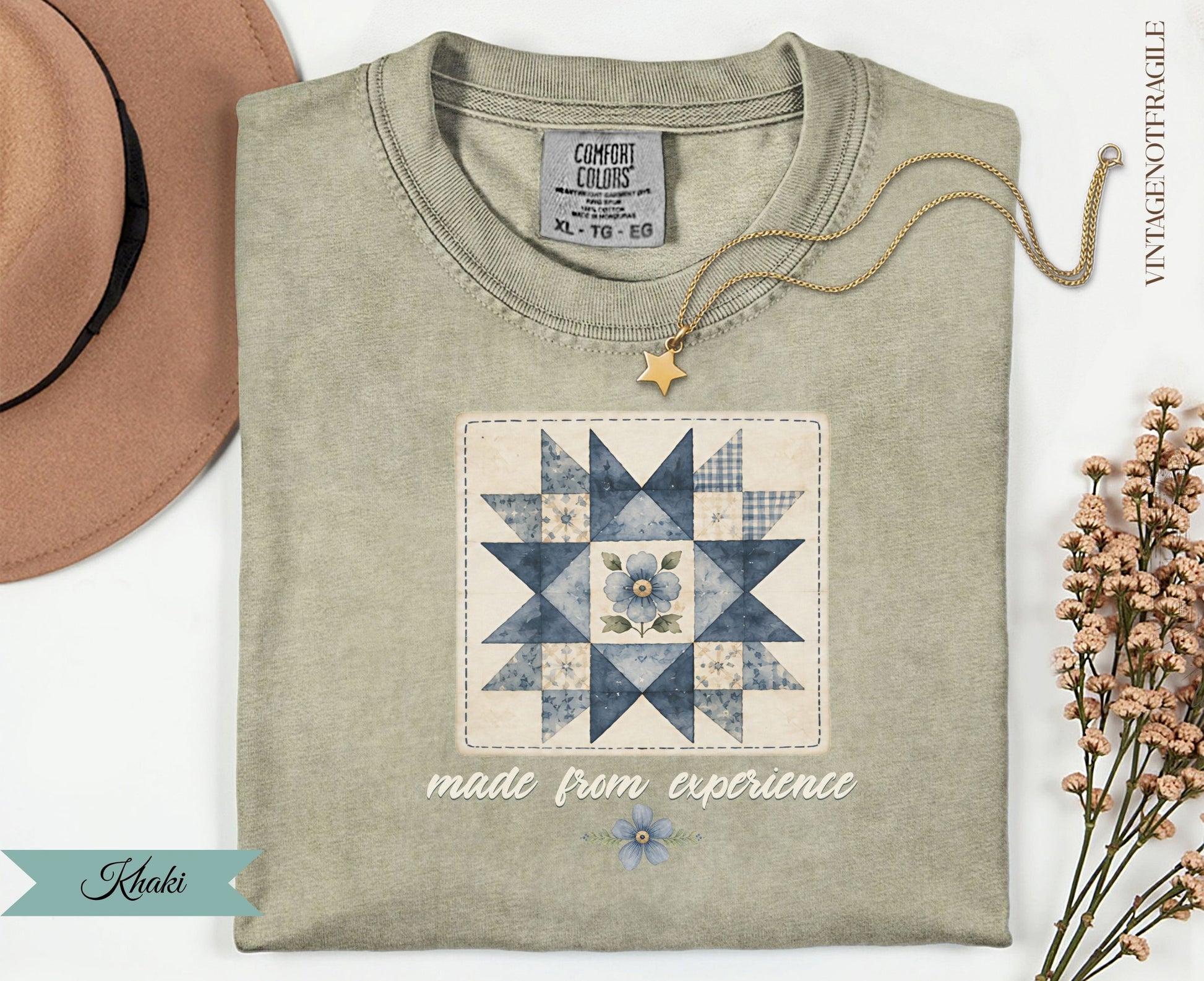 Quilted star with blue flower design on tan t-shirt, "made from experience" text.