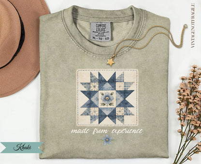 Quilted star with blue flower design on tan t-shirt, "made from experience" text.