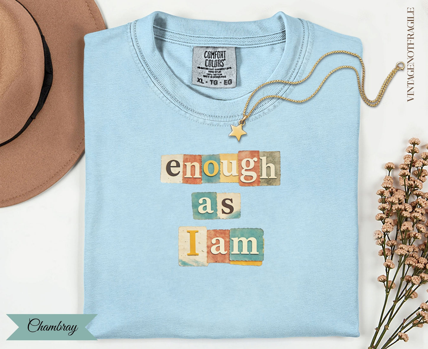 Light blue t-shirt with "enough as I am" in block letters.