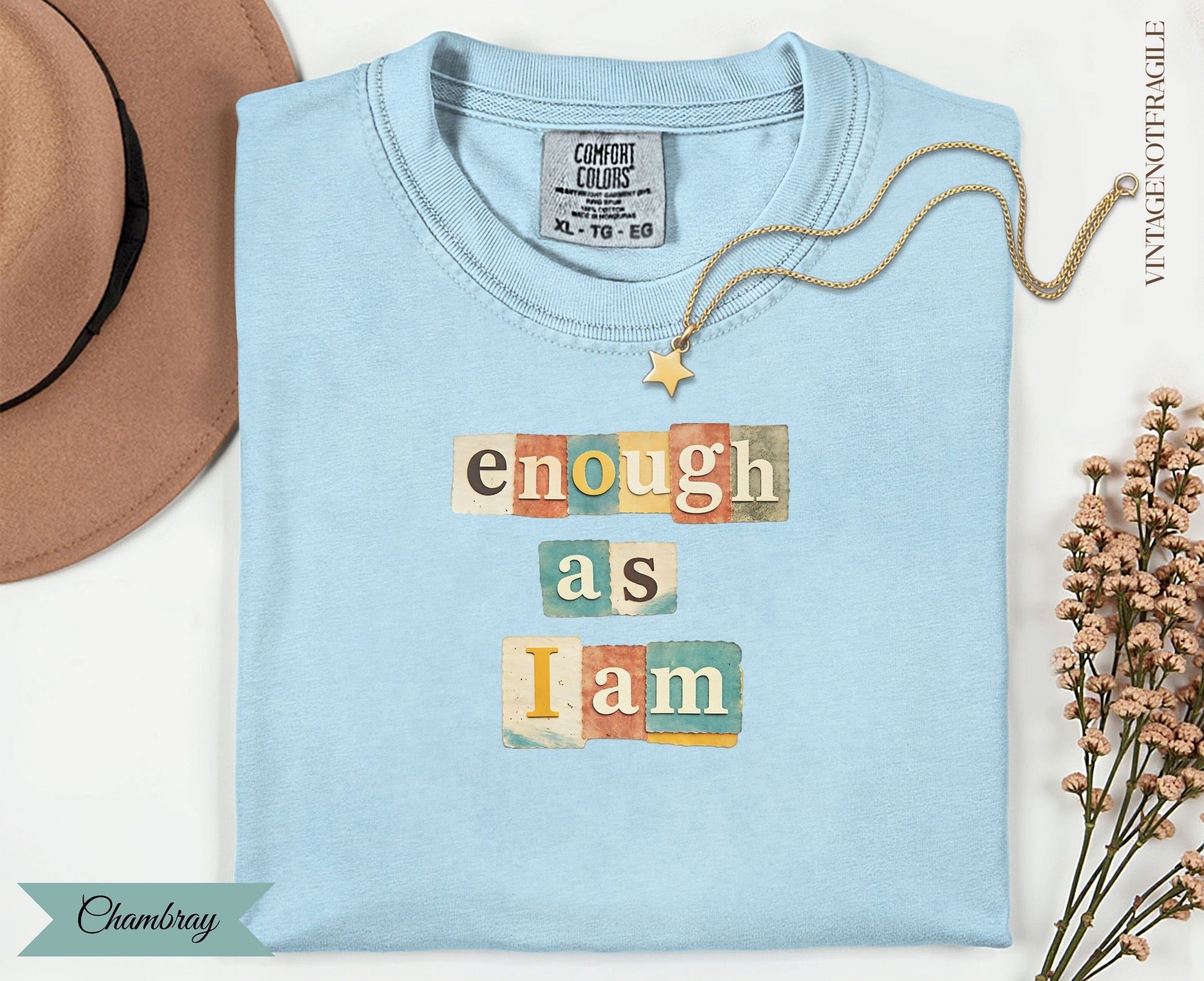 Light blue t-shirt with "enough as I am" in block letters.
