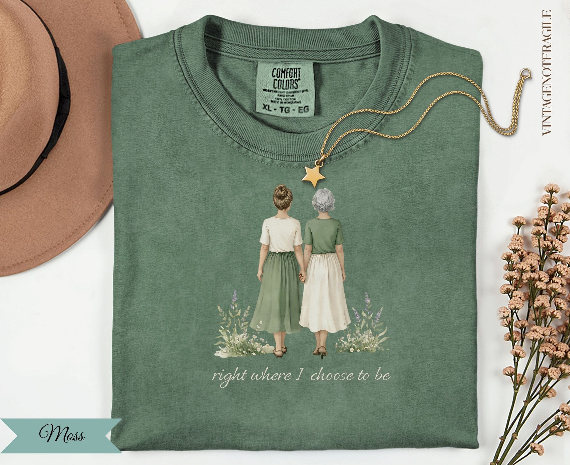 Green t-shirt with two women holding hands and text "right where I choose to be".