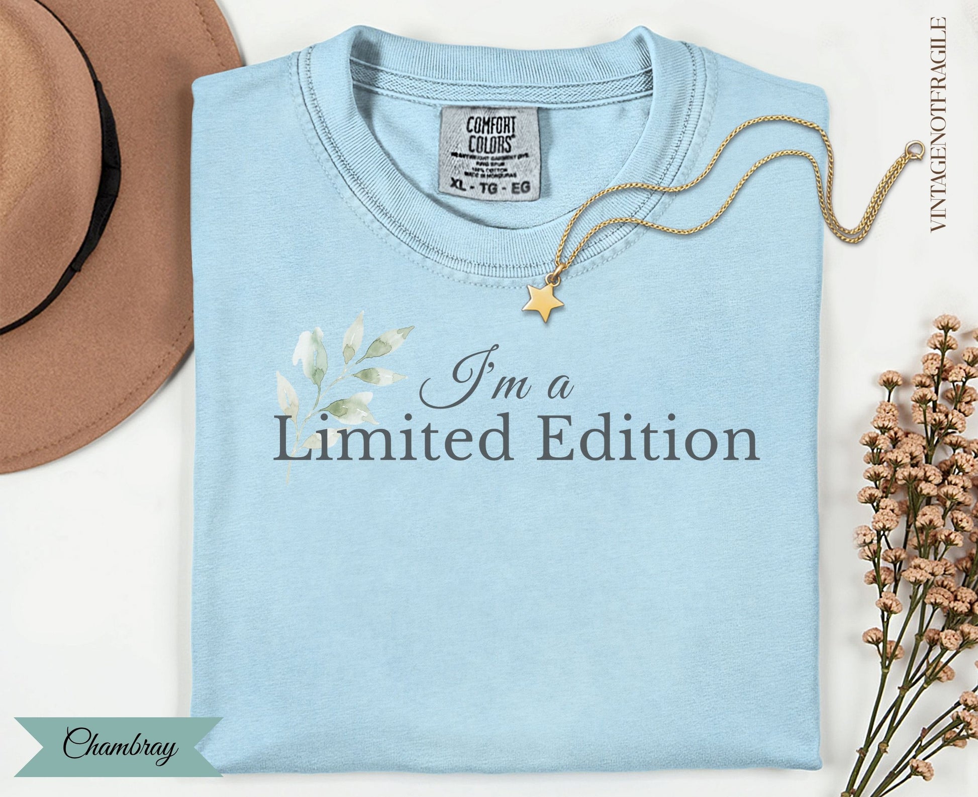 Light blue t-shirt with "I'm a Limited Edition" text and floral accents.