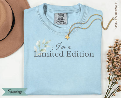 Light blue t-shirt with "I'm a Limited Edition" text and floral accents.