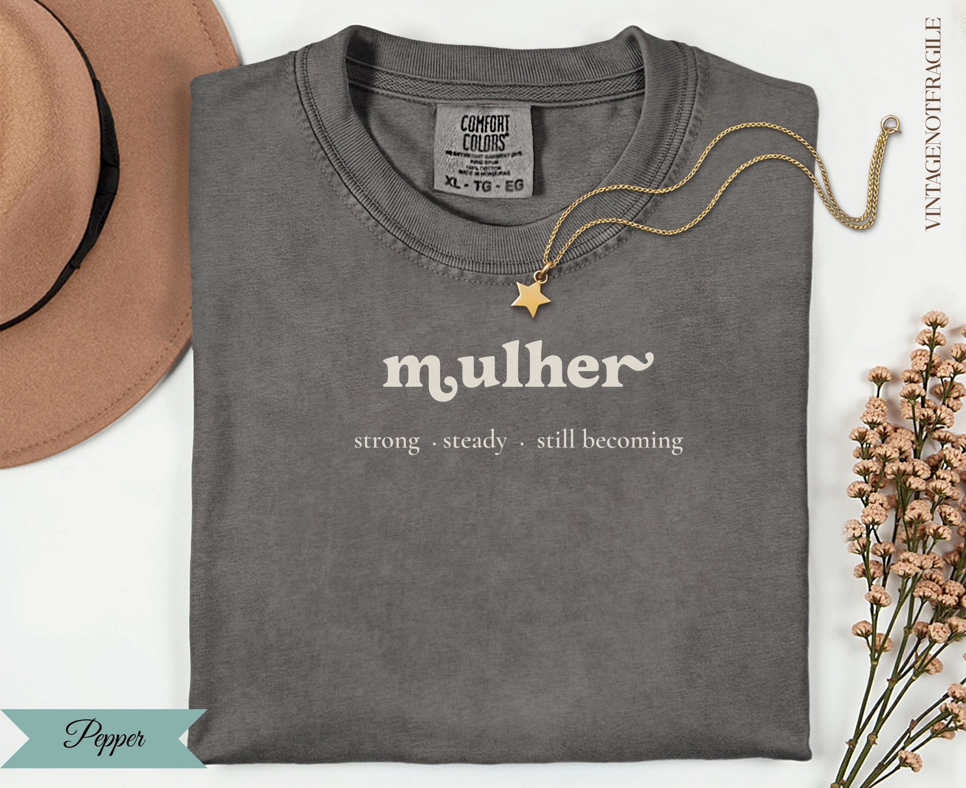Comfort Colors "mulher strong steady still becoming" t-shirt in charcoal gray.