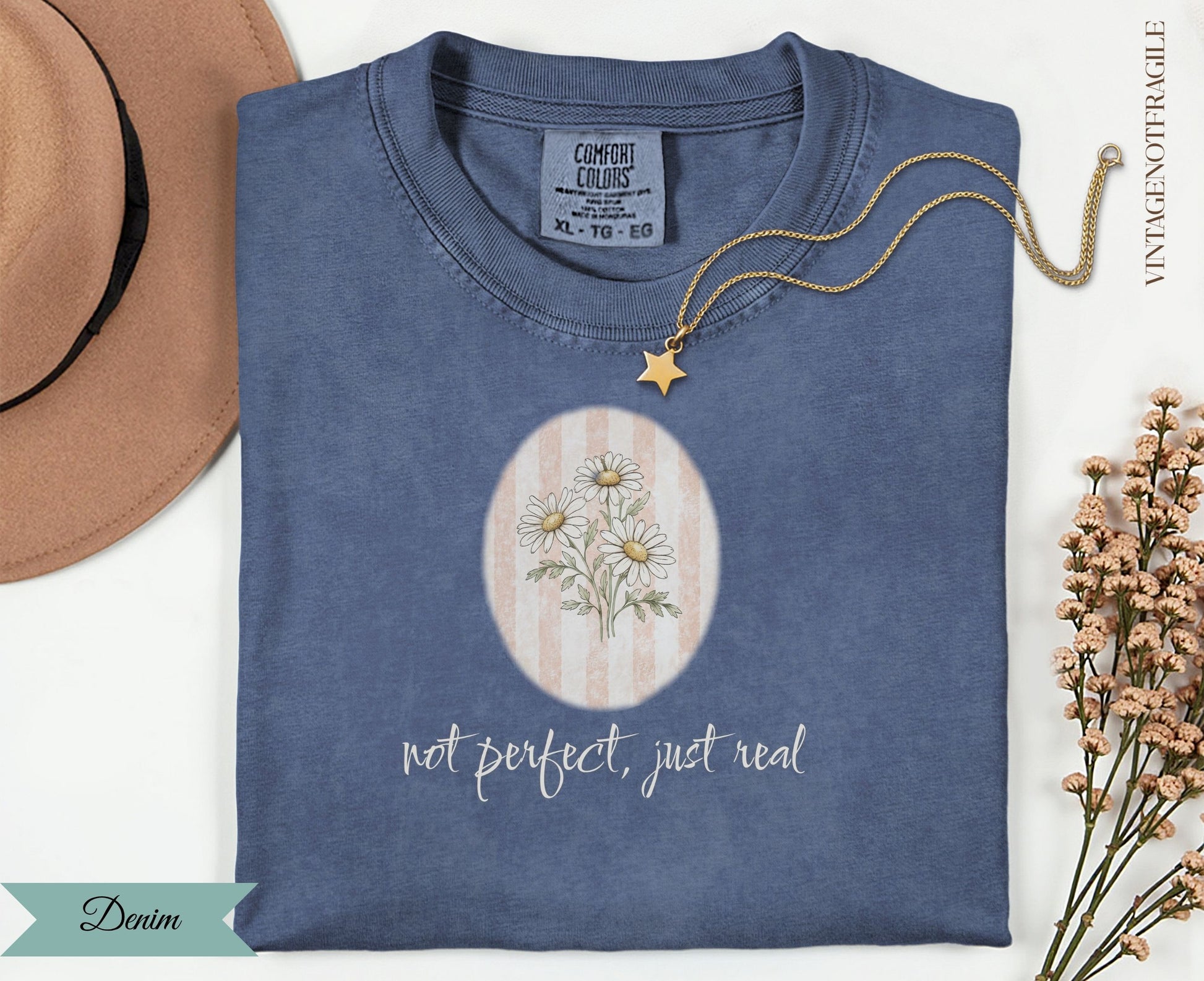 Denim t-shirt with "not perfect, just real" and daisy graphic.