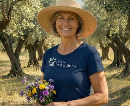 Woman in straw hat wearing a navy t-shirt with "I'm a Limited Edition" text.