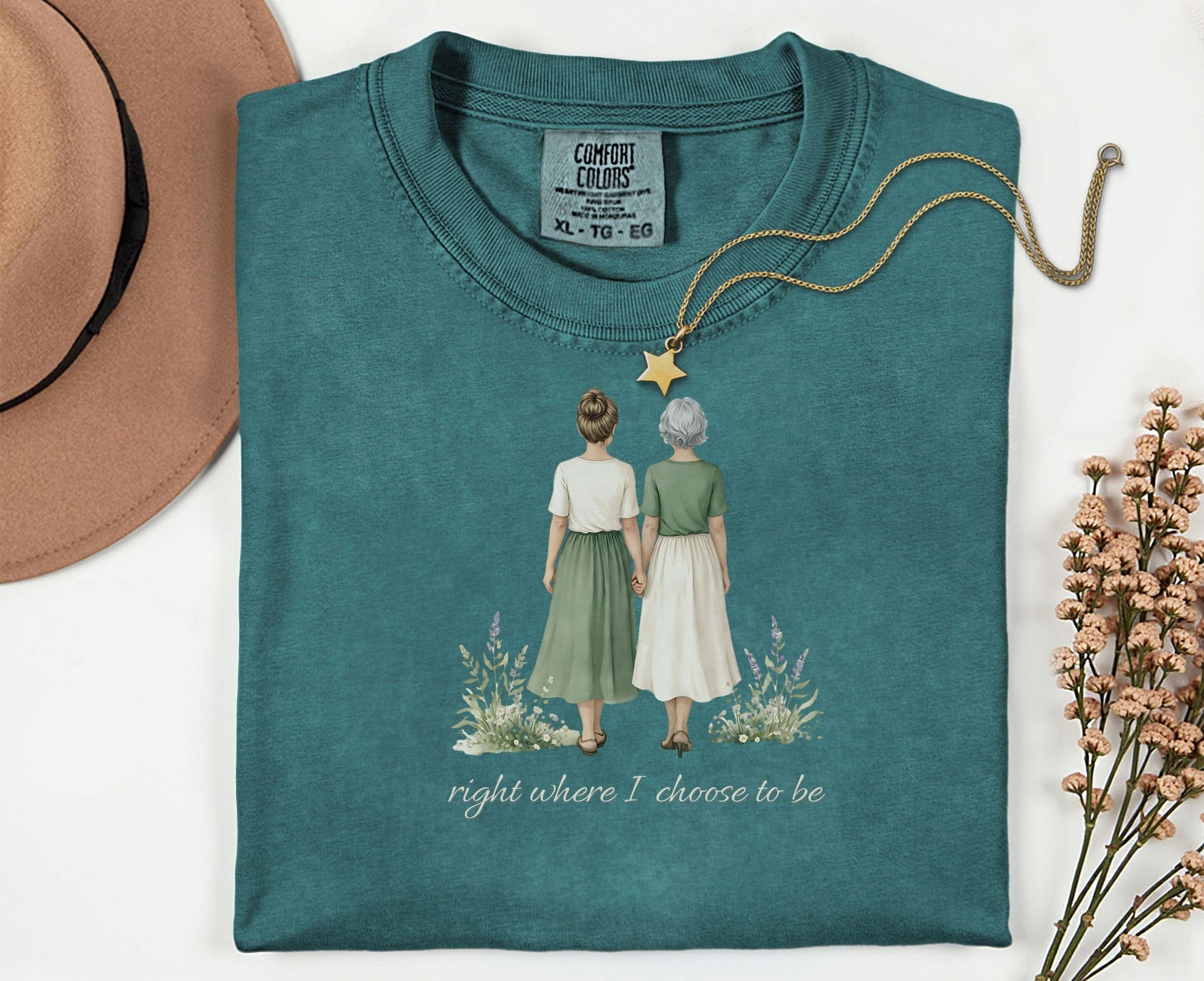 T-shirt with illustration of two women holding hands, text "right where I choose to be".