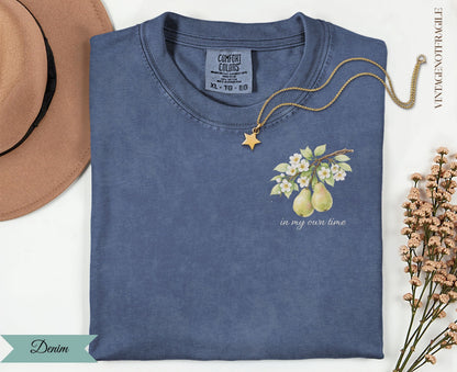 Denim t-shirt with pear branch design and "in my own time" text.
