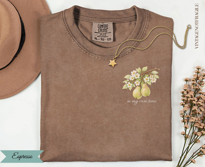 Brown Comfort Colors t-shirt with "in my own time" text and pear illustration.