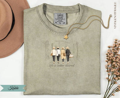 Olive green t-shirt with "life is better shared" graphic and "Kakhi" label.