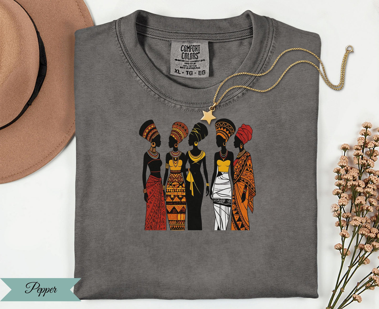Five women in colorful African-inspired clothing and hairstyles.