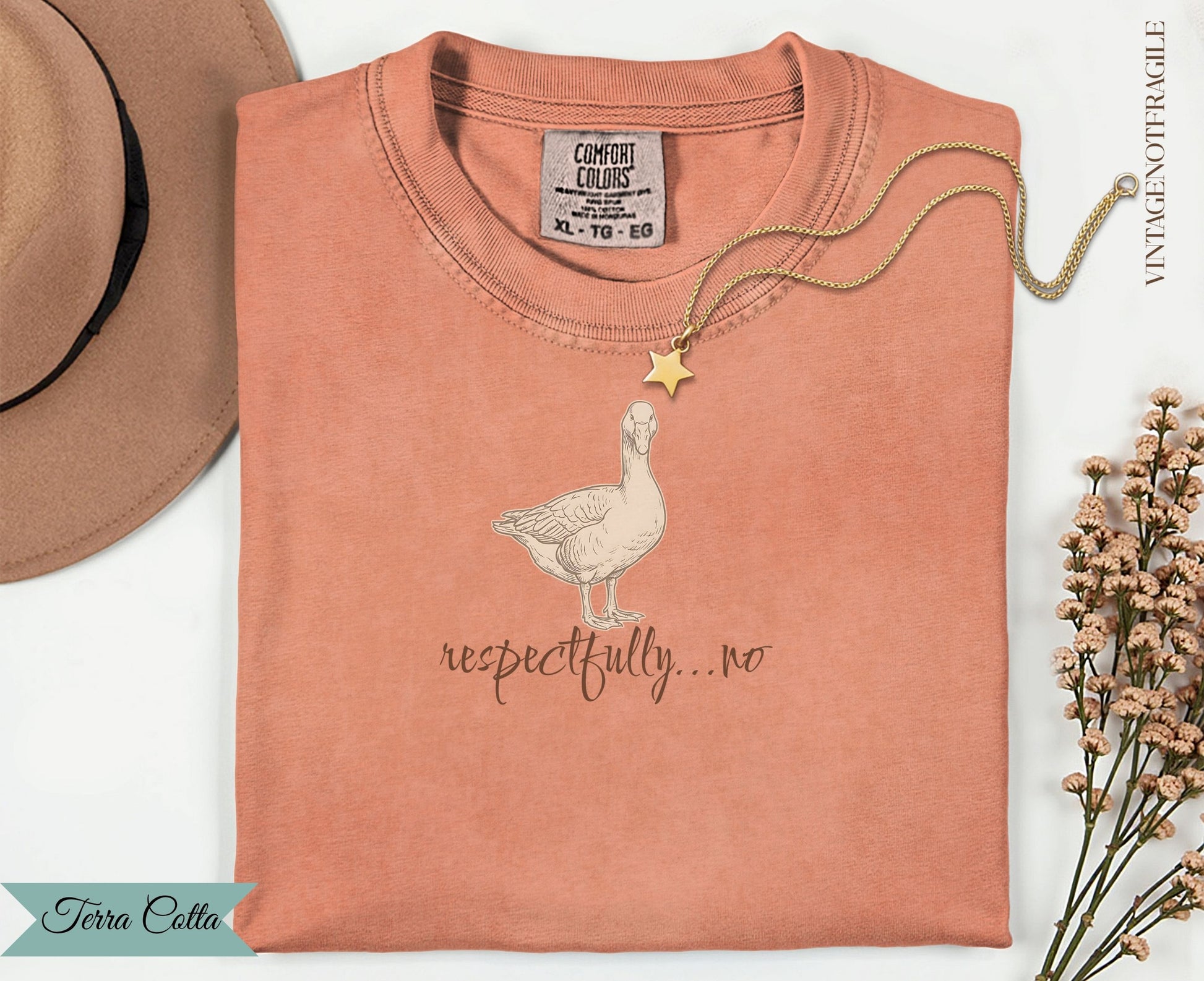 Peach t-shirt with a goose illustration and "respectfully...no" text.