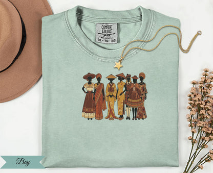 T-shirt with embroidered diverse women in traditional clothing and "Bay" logo.