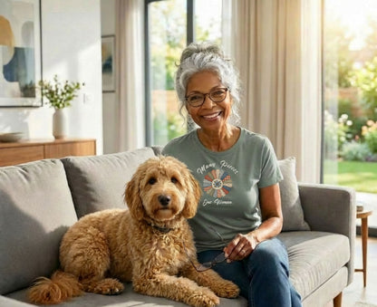 Woman with glasses and a dog on a couch, text reads "Many Pieces One Woman".