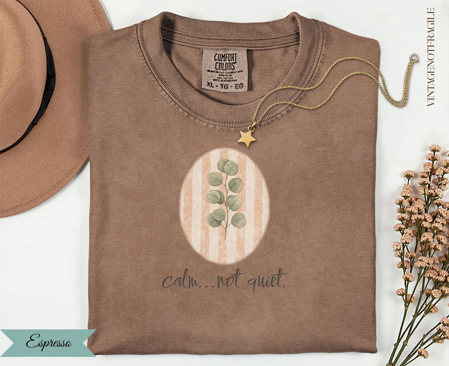 Espresso Comfort Colors t-shirt with oval botanical design and text "calm...not quiet."