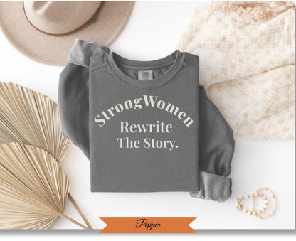 Comfort Colors sweatshirt with "Strong Women Rewrite the Story" text.