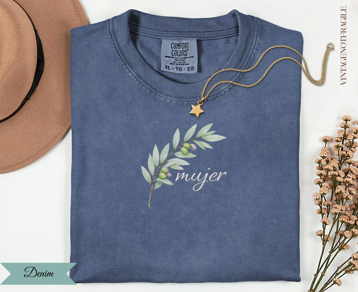 Blue t-shirt with olive branch design and "mujer" text.