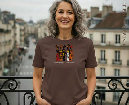 Woman wearing brown t-shirt with "Strong Women. Everywhere." graphic.