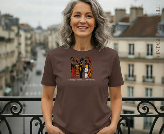 Woman wearing brown t-shirt with "Strong Women. Everywhere." graphic.
