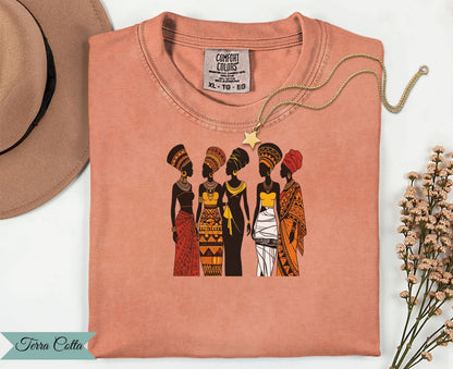T-shirt with graphic of five women in traditional African attire.
