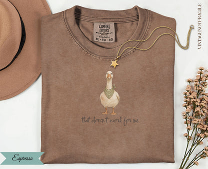 Brown t-shirt with a goose illustration and text "that doesn't work for me".