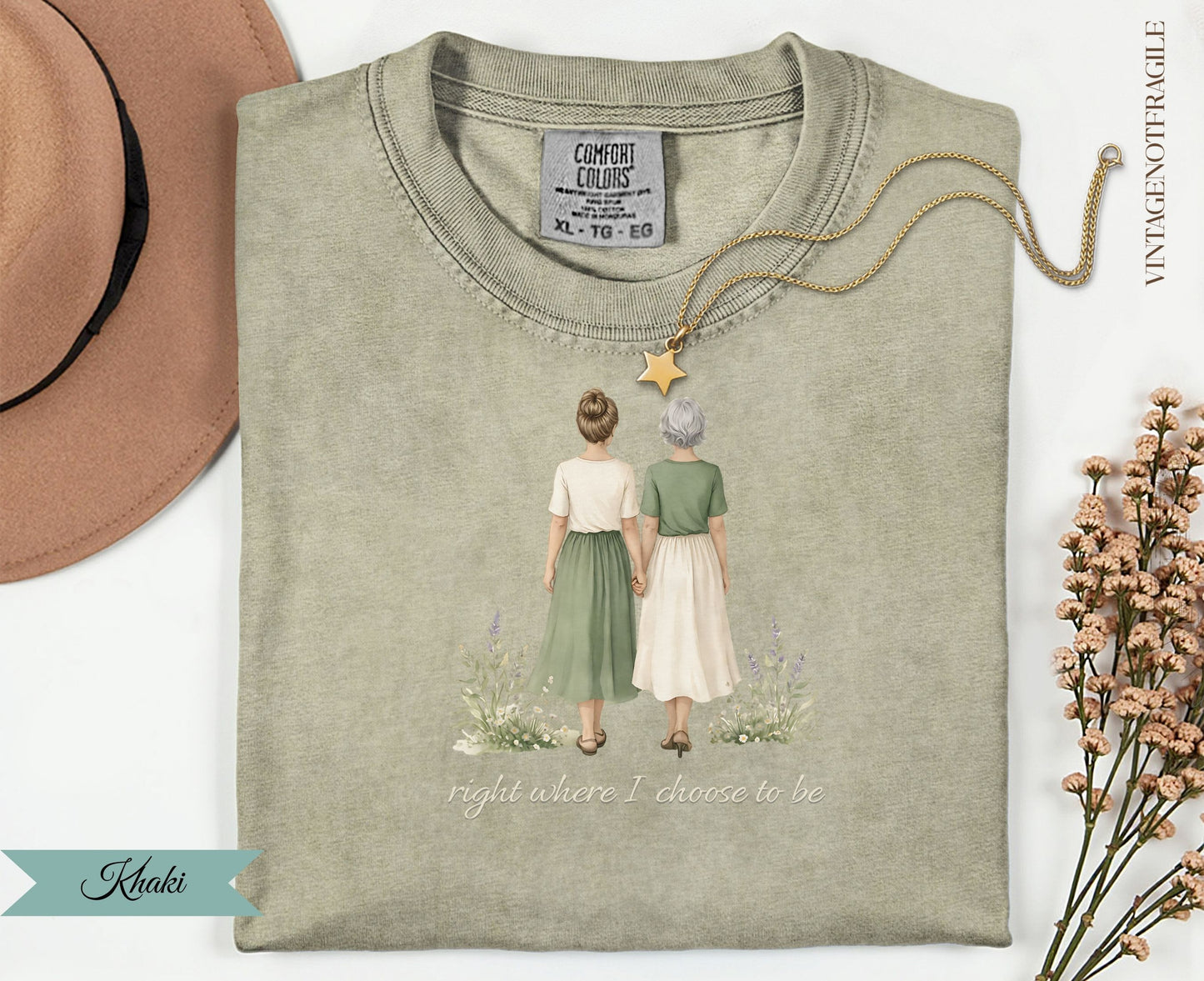T-shirt with graphic of two women holding hands, text "right where I choose to be".