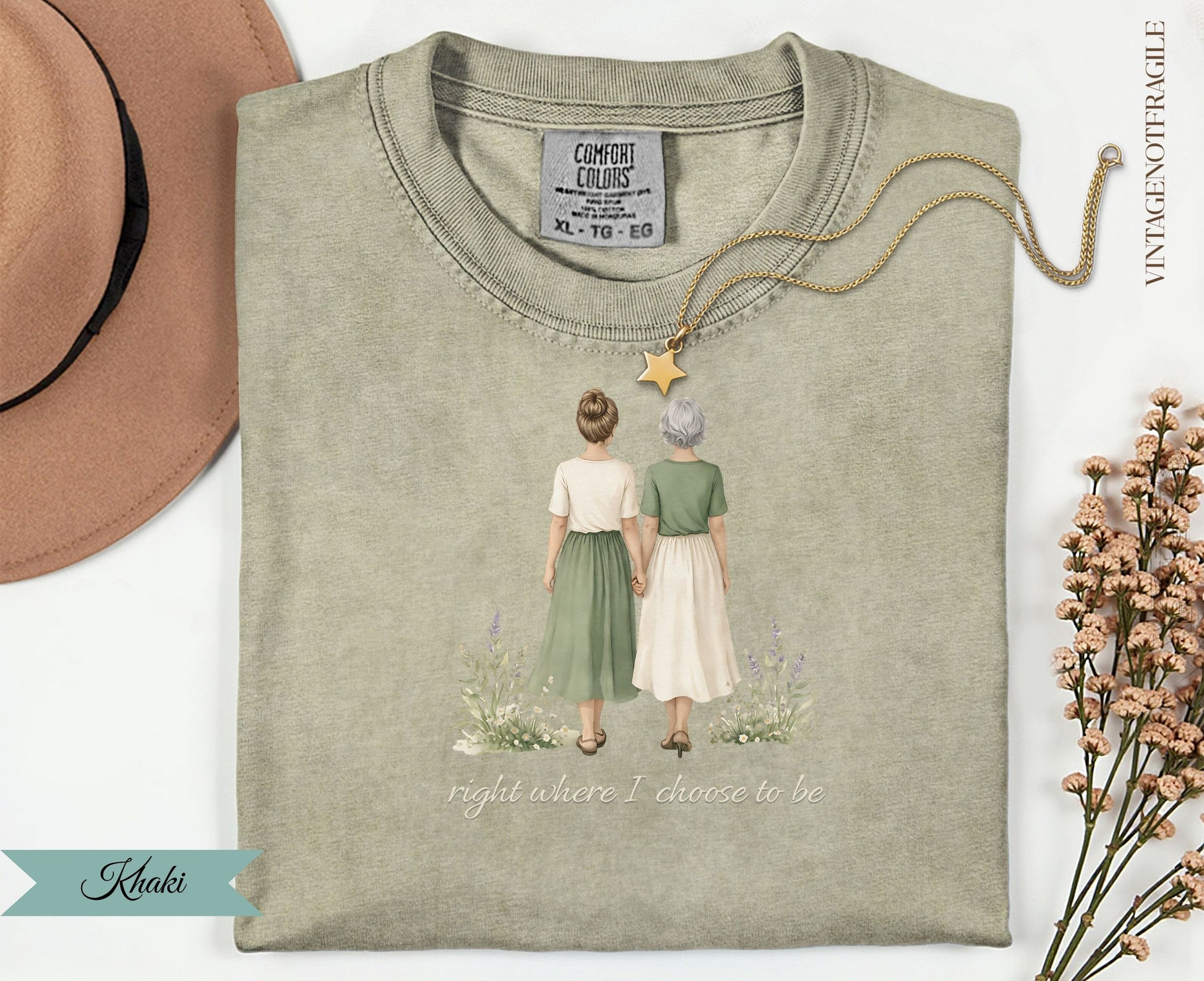T-shirt with graphic of two women holding hands, text "right where I choose to be".