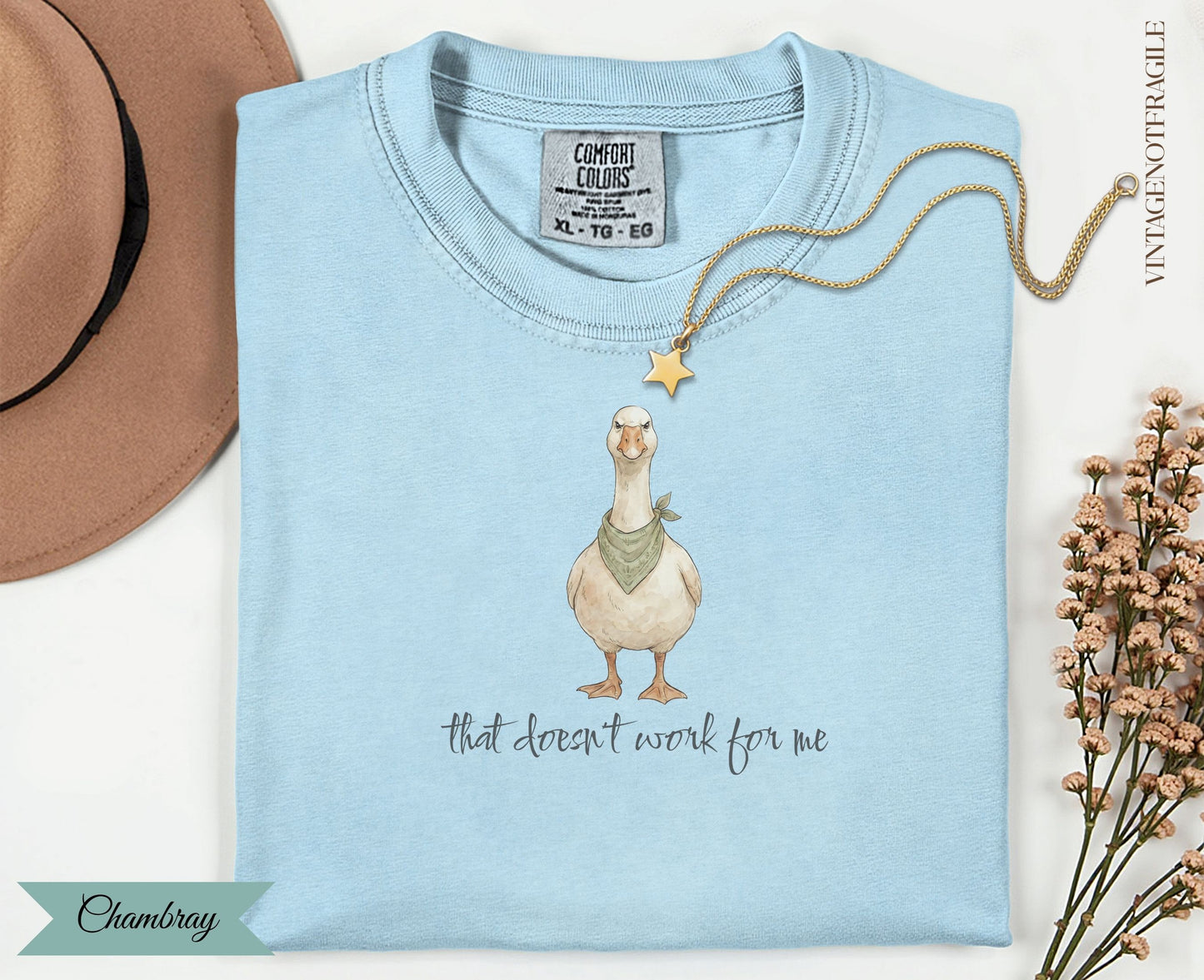 Light blue Comfort Colors t-shirt with a goose wearing a bandana and text "that doesn't work for me."