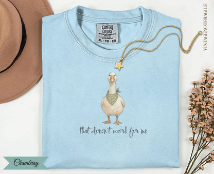 Light blue Comfort Colors t-shirt with a goose wearing a bandana and text "that doesn't work for me."