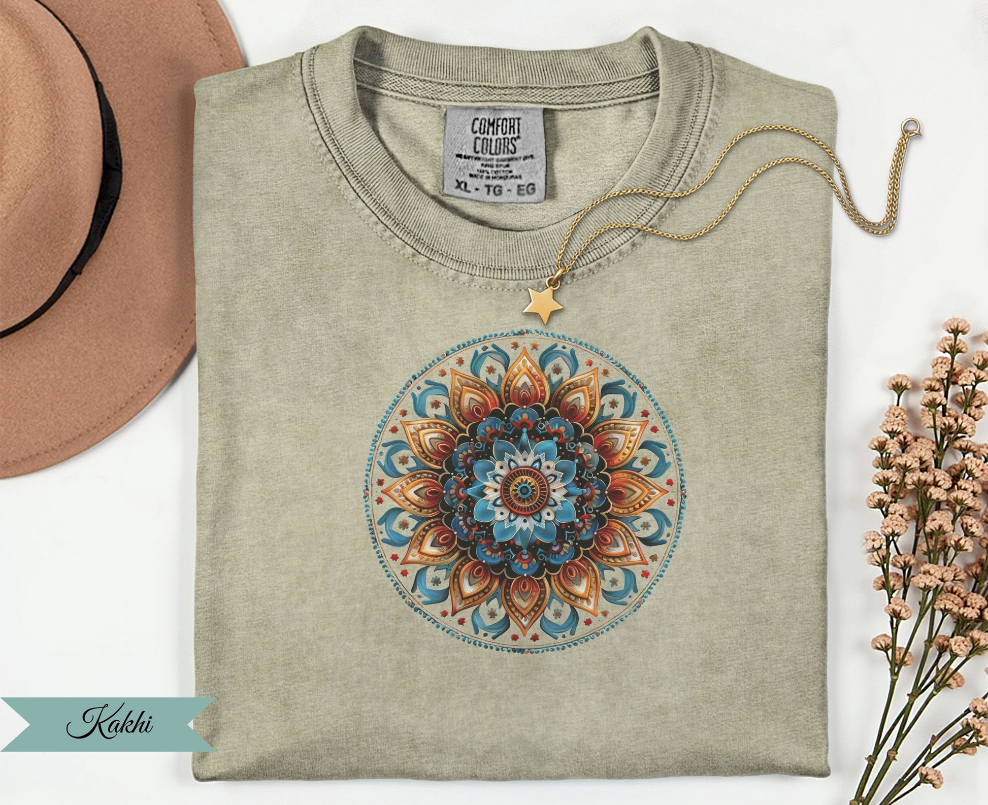 Kakhi t-shirt with colorful mandala design and gold star necklace.