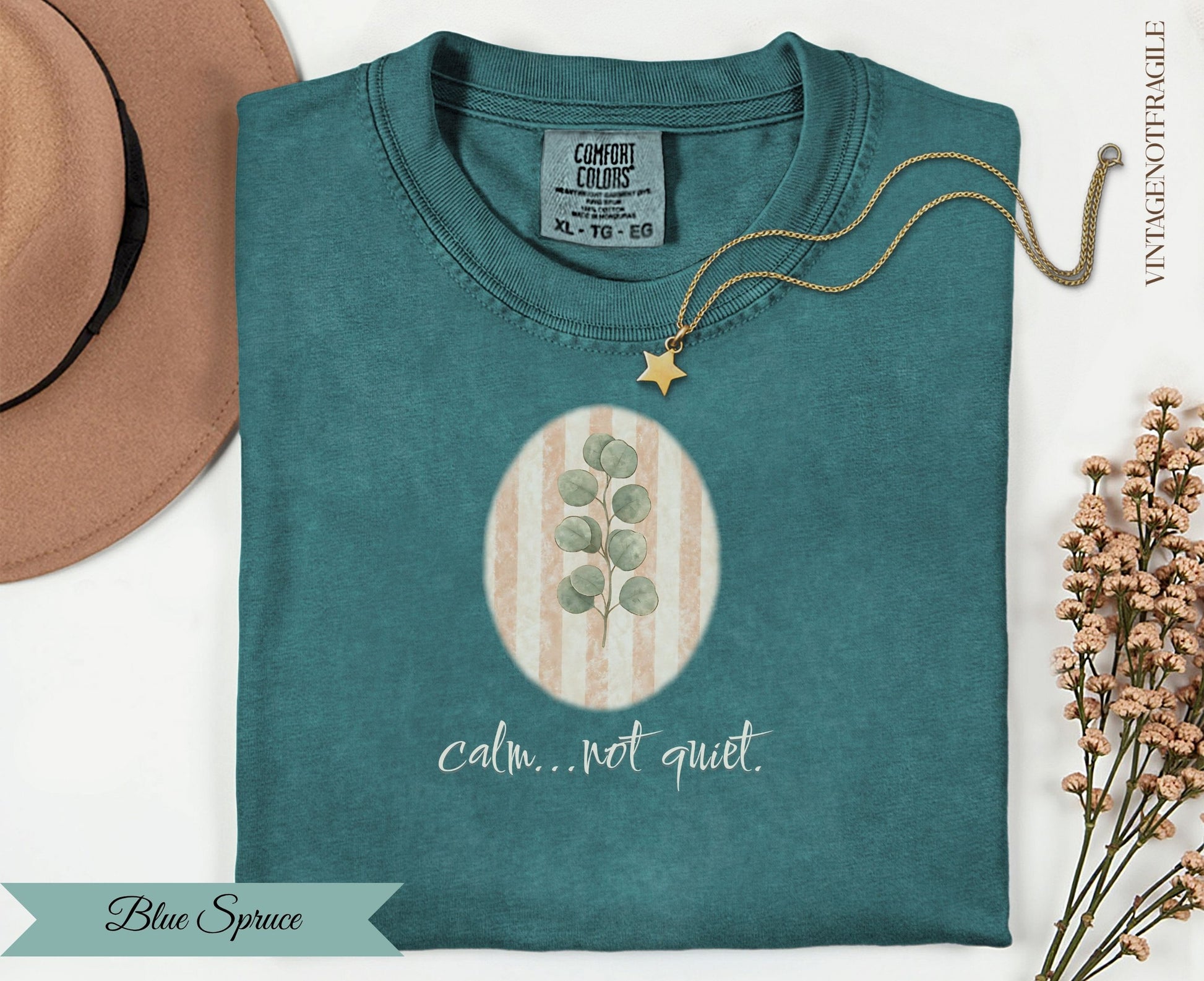 Comfort Colors teal t-shirt with oval leaf design and "calm...not quiet" text.