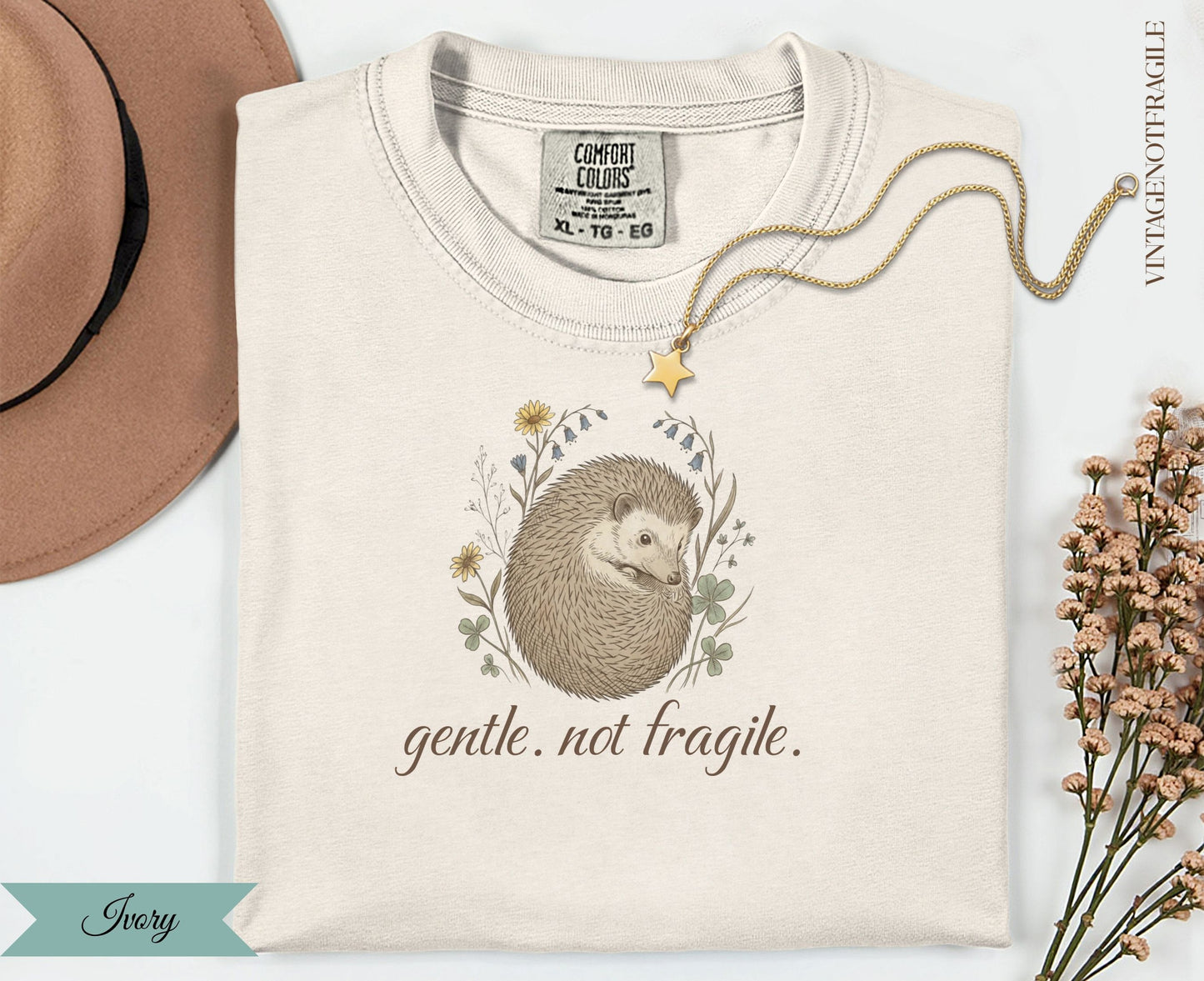 Cream t-shirt with hedgehog illustration and "Gentle. Not Fragile." text.