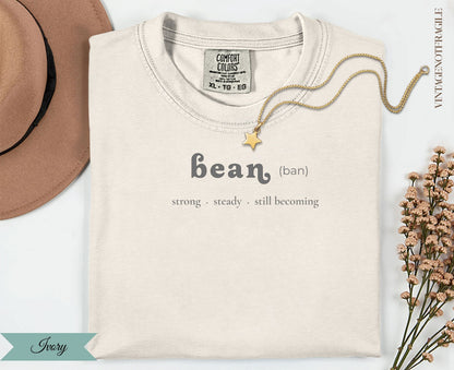 Cream Comfort Colors t-shirt with "bean" text and inspirational quote.